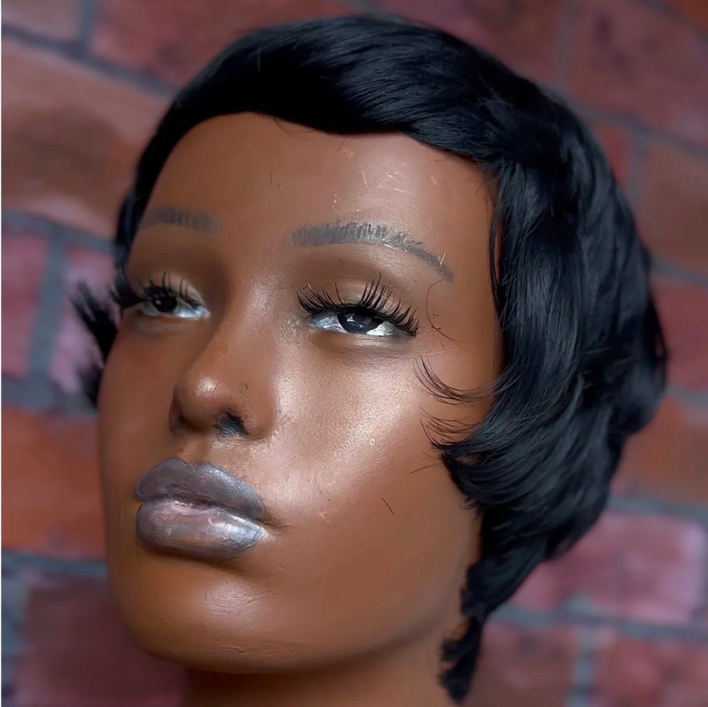The Ifẹ́ Pixie, a sleek custom-cut pixie wig with a graceful side-swept curve